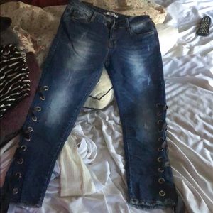 Gorgeous lace-up jeans with distressed look. NWT